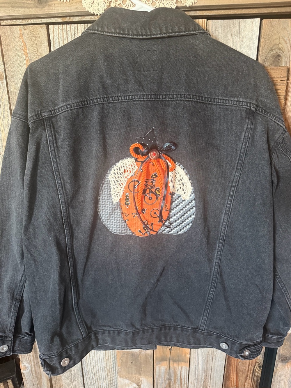 Women’s Black Denim Jacket with Orange Pumpkin Patchback Design